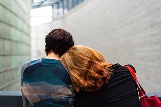 A mother and son sitting together.