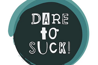 circular logo with the motto “Dare to Suck”