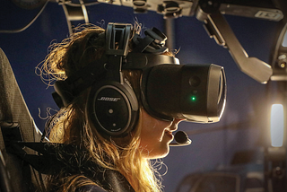 Picture of a person wearing virtual reality goggles.