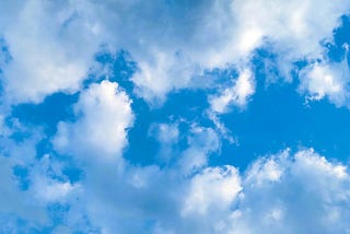 image of a blue sky with white clouds, by the Author
