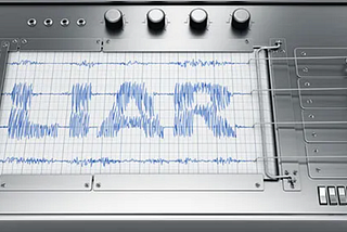 Lie detector machine that has the word liar scribbled on the paper that feeds from the machine when in use