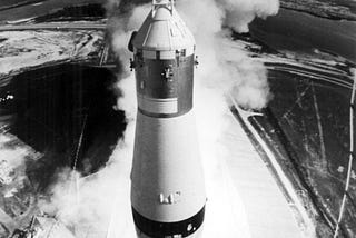 Black and white photo of the liftoff of Apollo 11