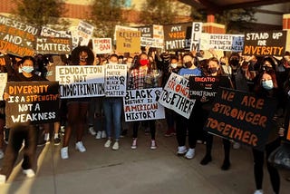 Many students and faculty members hold signs protesting the book ban in front of Central York High School.