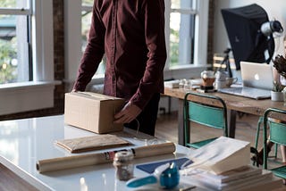 Man processing and packing orders to ship