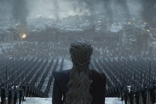 An image from HBO’s Game of Thrones. Daenerys Targaryen watches over her troops. They stand in formation, ahead of a battlefield.