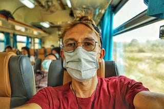 Traveling during the Coronavirus outbreak on a train to Bangkok, Thailand.