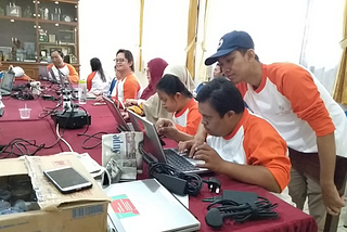 Group photo of Youth working on the E-Learning Drawing Book by computers.