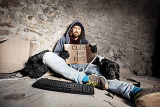 Jobless man sitting on city sidewalk with his dog