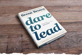 Dare to Lead book on wooden table