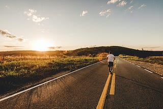 Man running in the middle of the road