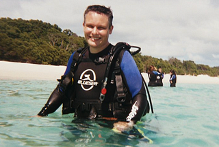 a person getting ready to scuba dive