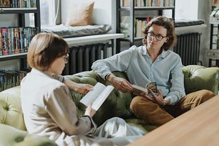 Two women discussing books