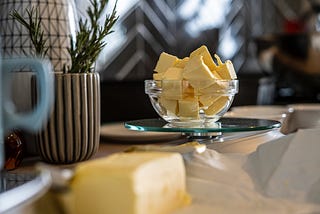 butter in glass dish with nice dining background