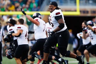 Northern Illinois offensive lineman Abiathar Curry jumps in the air in celebration after wining a NCAA college football game 16–14 against Notre Dame at Notre Dame Stadium on Saturday, Sept. 7, 2024, in South Bend. (Curt Rallo / The Associated Press)