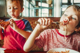 kids eating spaghetti