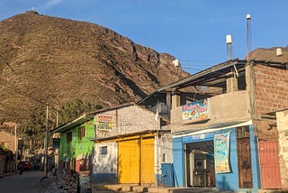 Brightly painted homes and shops in Urubamba, Peru