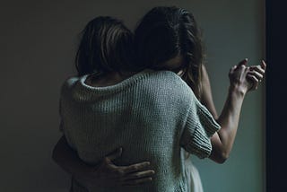 Two women hugging