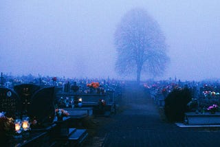 A large graveyard at night