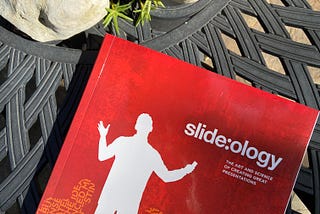 The book Slide:ology sitting on my patio table.