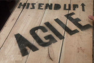A wooden box marked AGILE, THIS END UP (edited from the FRAGILE box from the movie A Christmas Story)