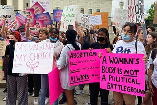 Washington DC. Photo of protesters in front of the supreme court in Washington, DC on 5/5/22. They are protesting against the leaked document in which the legal decision of roe versus wade is challenged. Abortions could no longer be available in every state, only democratically controlled states necessitating travel.