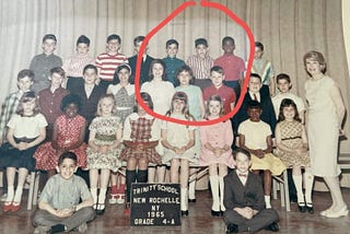 A class photo with one very unhappy child.