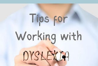 person writing ‘tips for working with dyslexia’ on a transparent wall