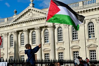 Palestinian flag, boy, protest march, government building