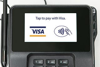 Payment screen displaying a credit card input field, a touchless ‘Pay’ button, and numbers 1–9.