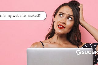 woman scratching her head wondering if her website was hacked.