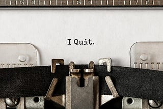 Old school typewriter with the words “I Quit.” typed on white paper | how not to quit your job business life article