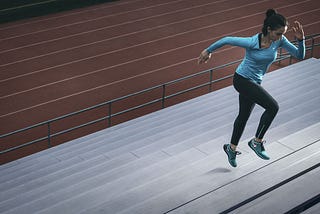 Woman running steps for cardio.
