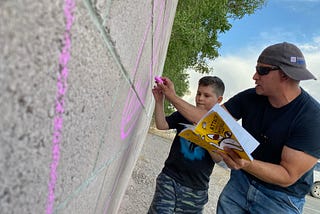 Española muralists create a strong message for the community: “100% can thrive” and “No…