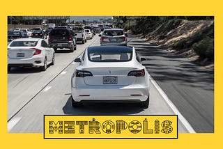 A Tesla driving in freeway traffic