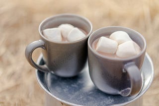 Two cops of hot chocolate with marshmallows