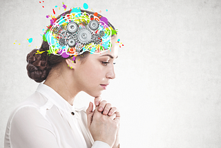 Picture of a woman’s profile with a drawing representing her brain colorfully drawn on her head