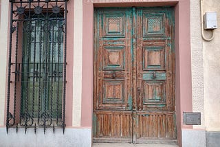 an old door in Barcelona. The old architecture is absolutely beautiful, and replicated in the Mexican city of Merida almost exactly.