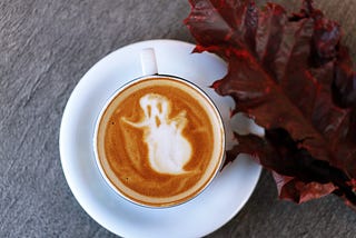 Latte art with a ghost in the foam
