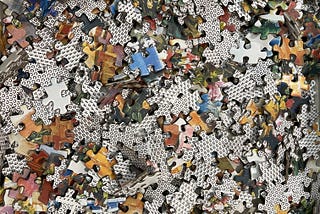 jigsaw puzzle pieces in a pile
