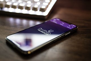 A mobile device with the Twitch logo displayed.