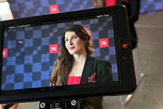 Anya Smith being interviewed at Harvard Innovation Lab. Setting in front of camera