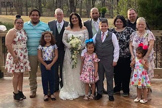 One of my wedding photos with the family that adoption built.