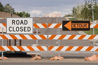 Detour sign on a closed road