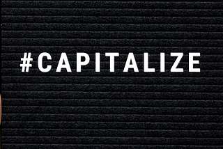 #Capitalize is spelled out in white block capitals on an a black background