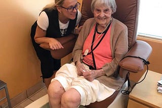 A girl with older lady in the nail salon.