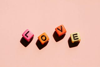 Four letters: l, o, v, e on dices