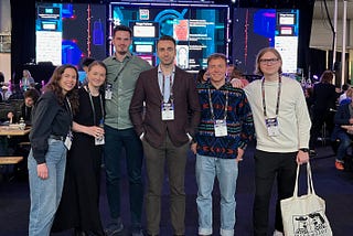 Members of the EQT Motherbrain team standing in the main pavillion at the Data Innovation Summit 2023 in Stockholm, Sweden.