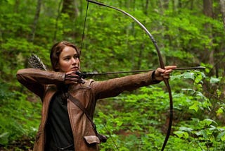 How does The Hunger Games Criticise American Society?
