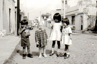 Photo of Linda as a small child in Veracruz, Mexico. Sticking out like a sore thumb.