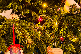 A Christmas tree extreme close-up with various baubles